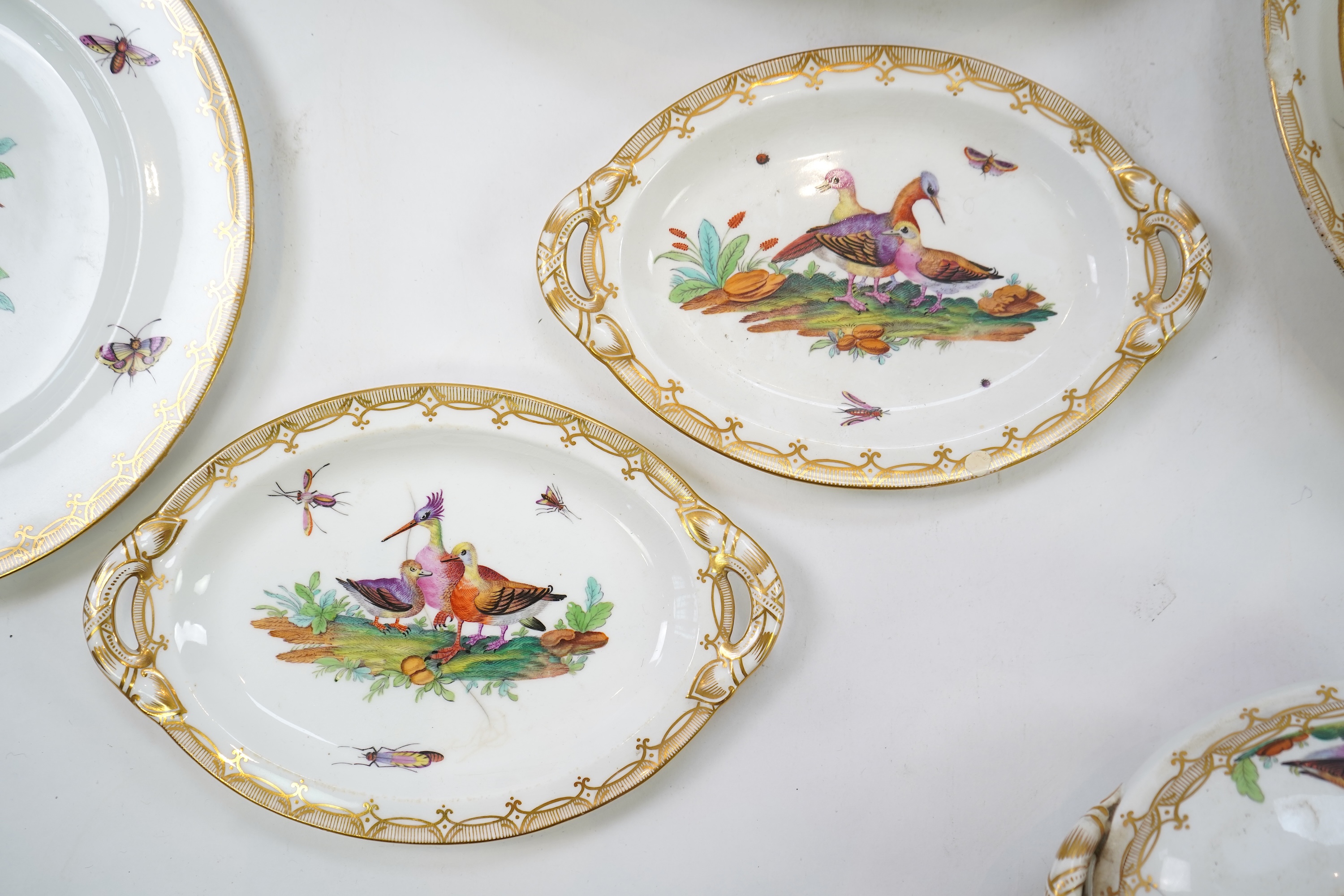 A Coalport bird painted part dinner service, mid 19th century